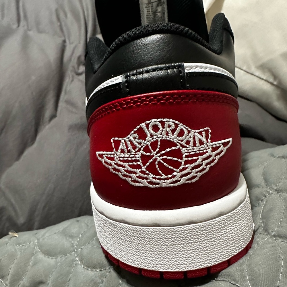 Jordan Air 1 Low in White, Black, and Red - Picture 12 of 14